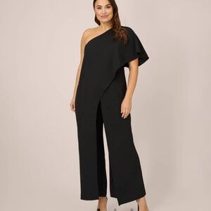 Adrianna Papel PLUS SIZE FLUTTER ONE SHOULDER JUMPSUIT IN BLACK